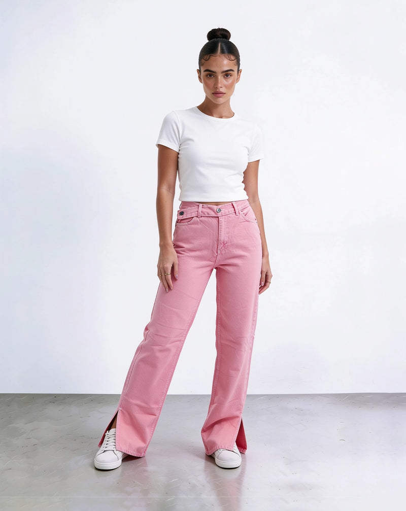 Pink straight-leg high-waisted jeans with crisscross belt.