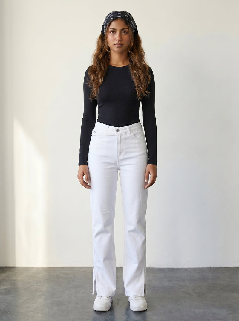 High-waisted white straight-leg jeans with a crisscross belt.