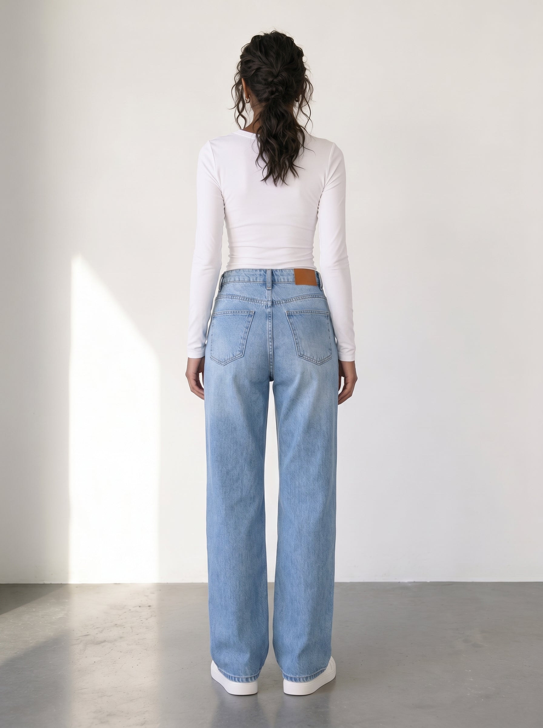 High-waisted mom fit jeans with distressed details
