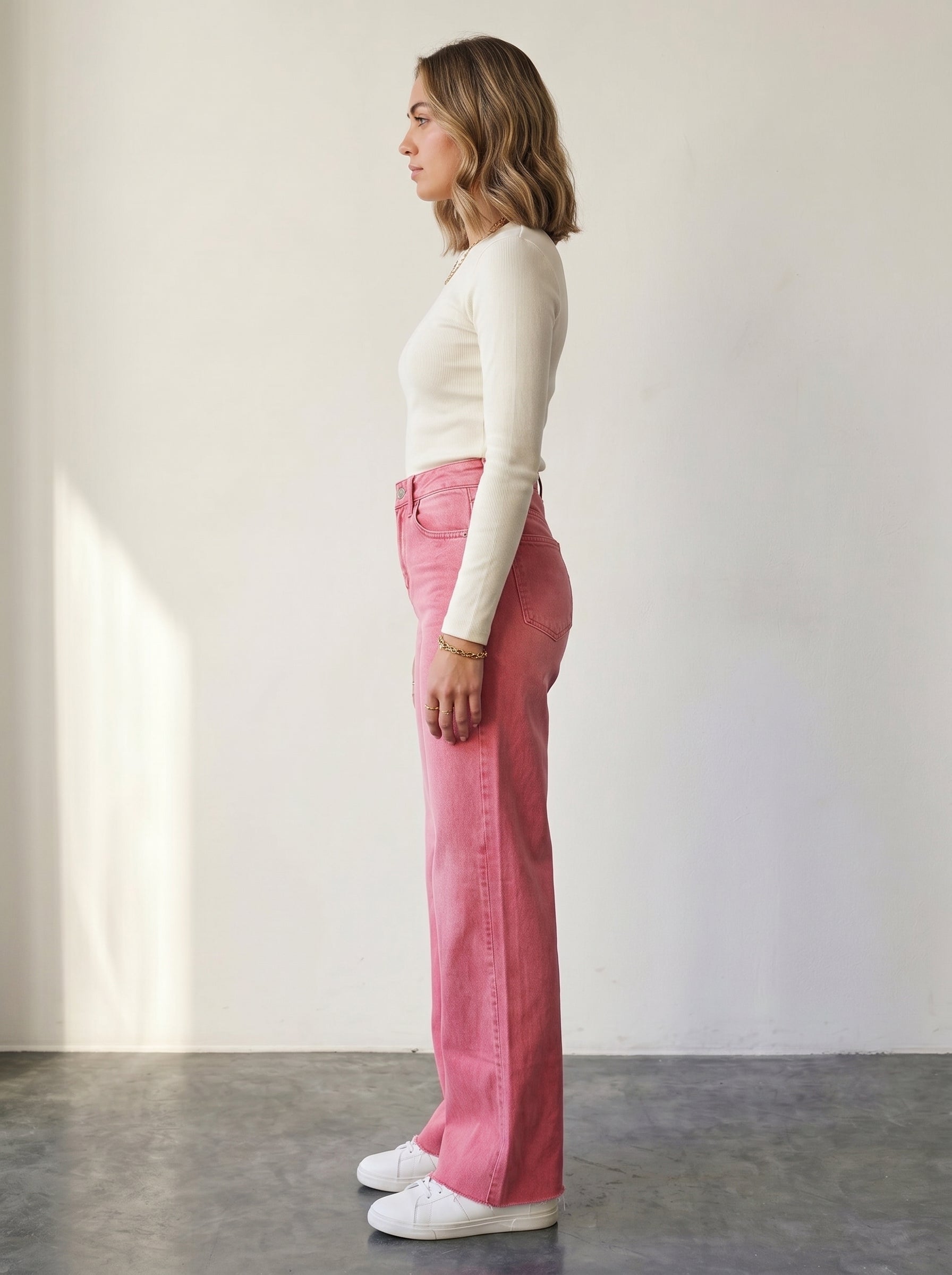 Pink high-waisted wide-leg jeans.