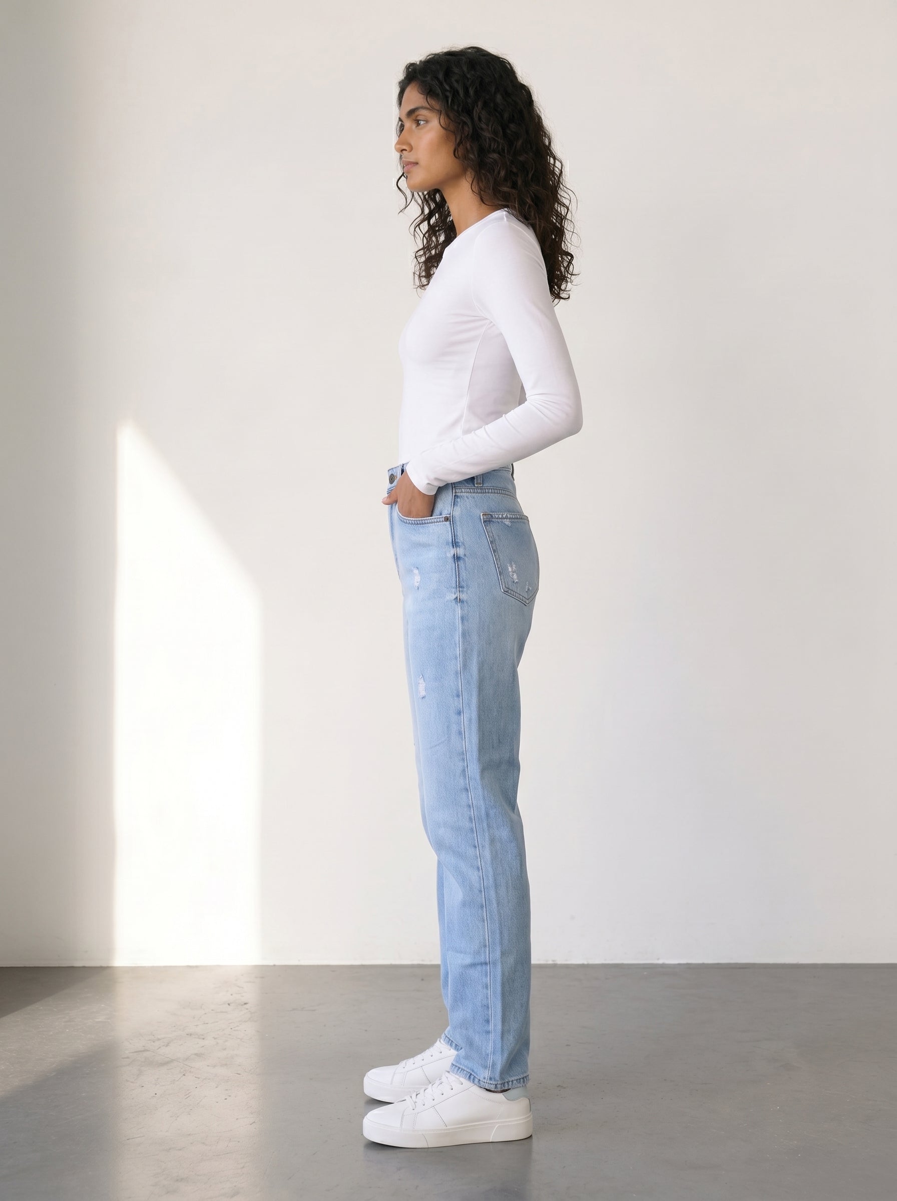 High-waisted mom fit jeans with distressed details