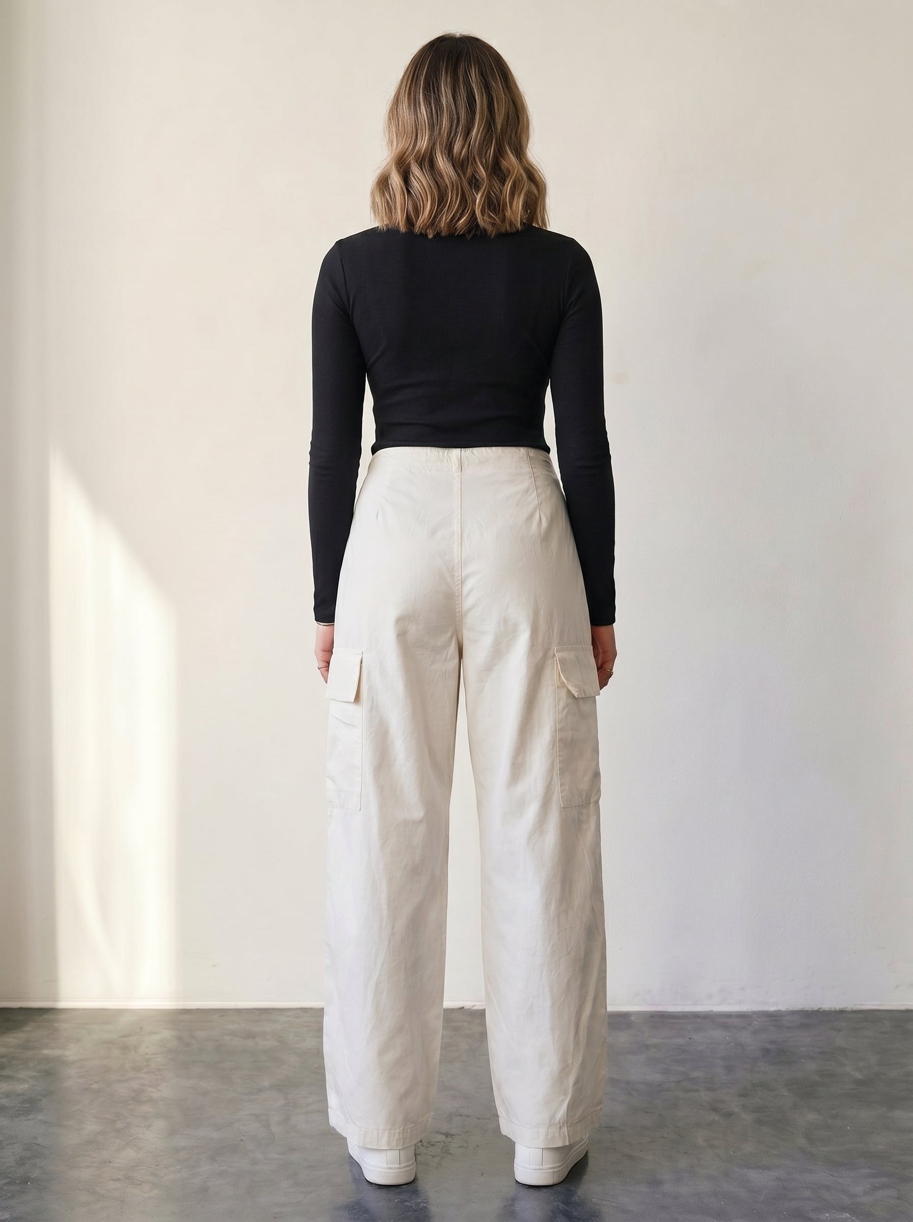 Light beige high-waisted cargo pants with a drawstring.