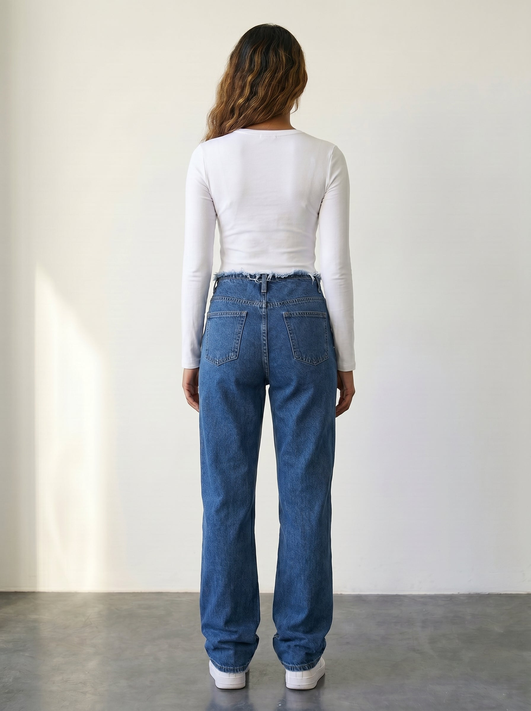High-waisted straight-leg jeans with raw-edge waist detail