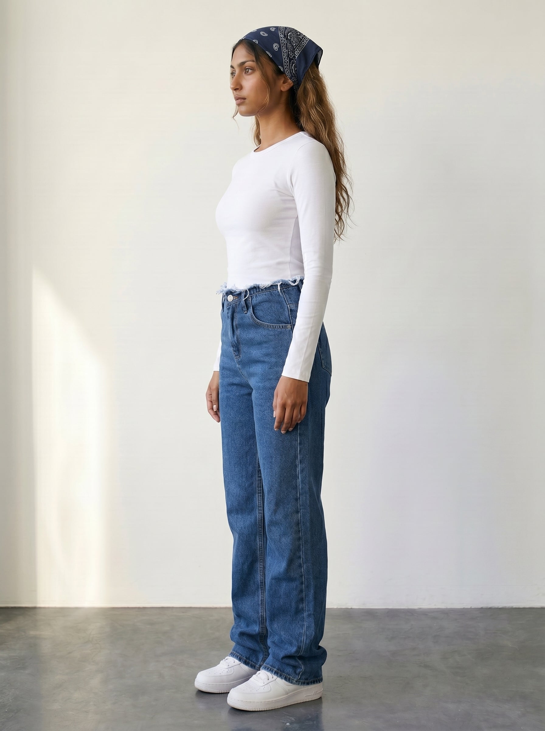 High-waisted straight-leg jeans with raw-edge waist detail