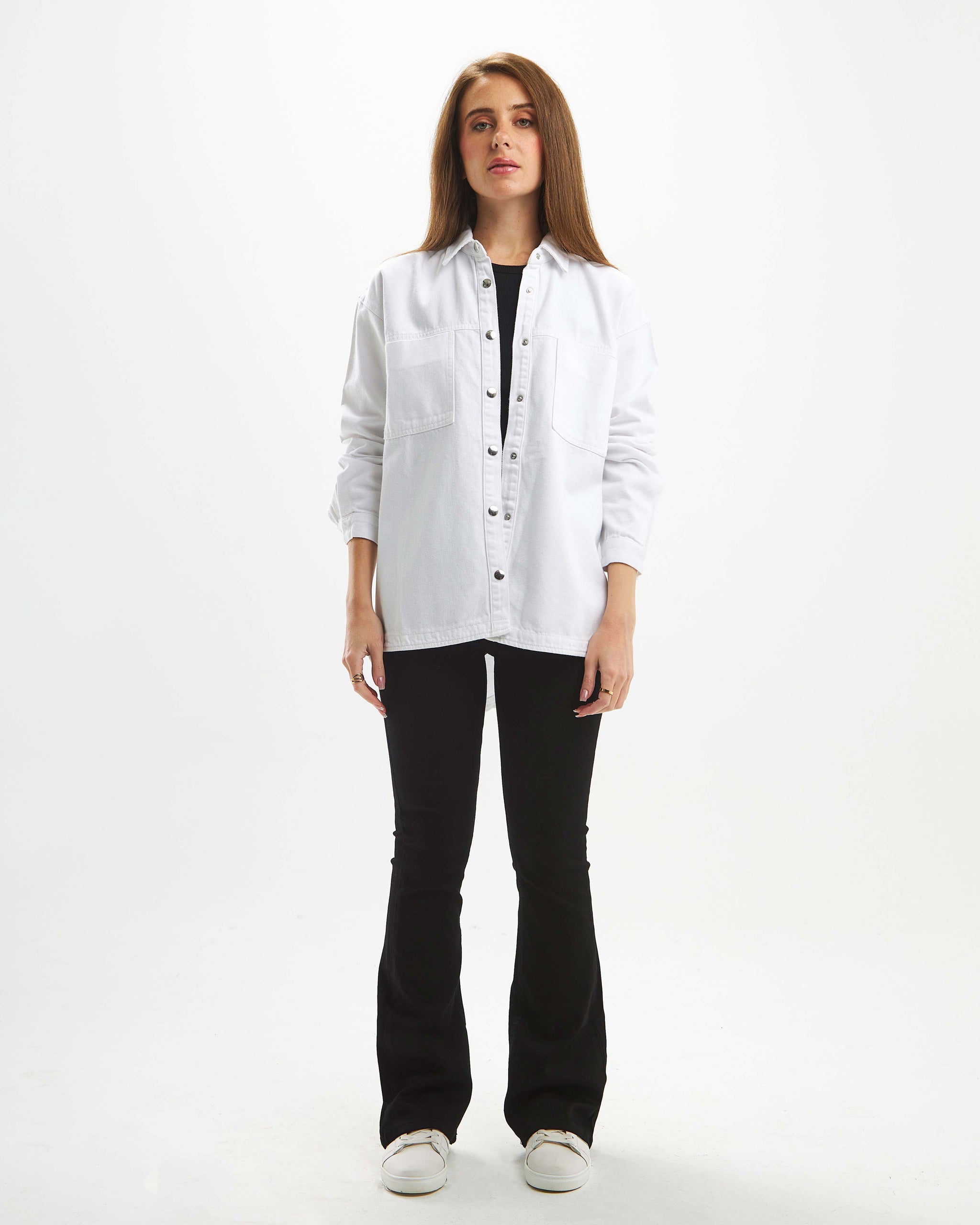 White denim jacket with front pocket details and a loose fit.