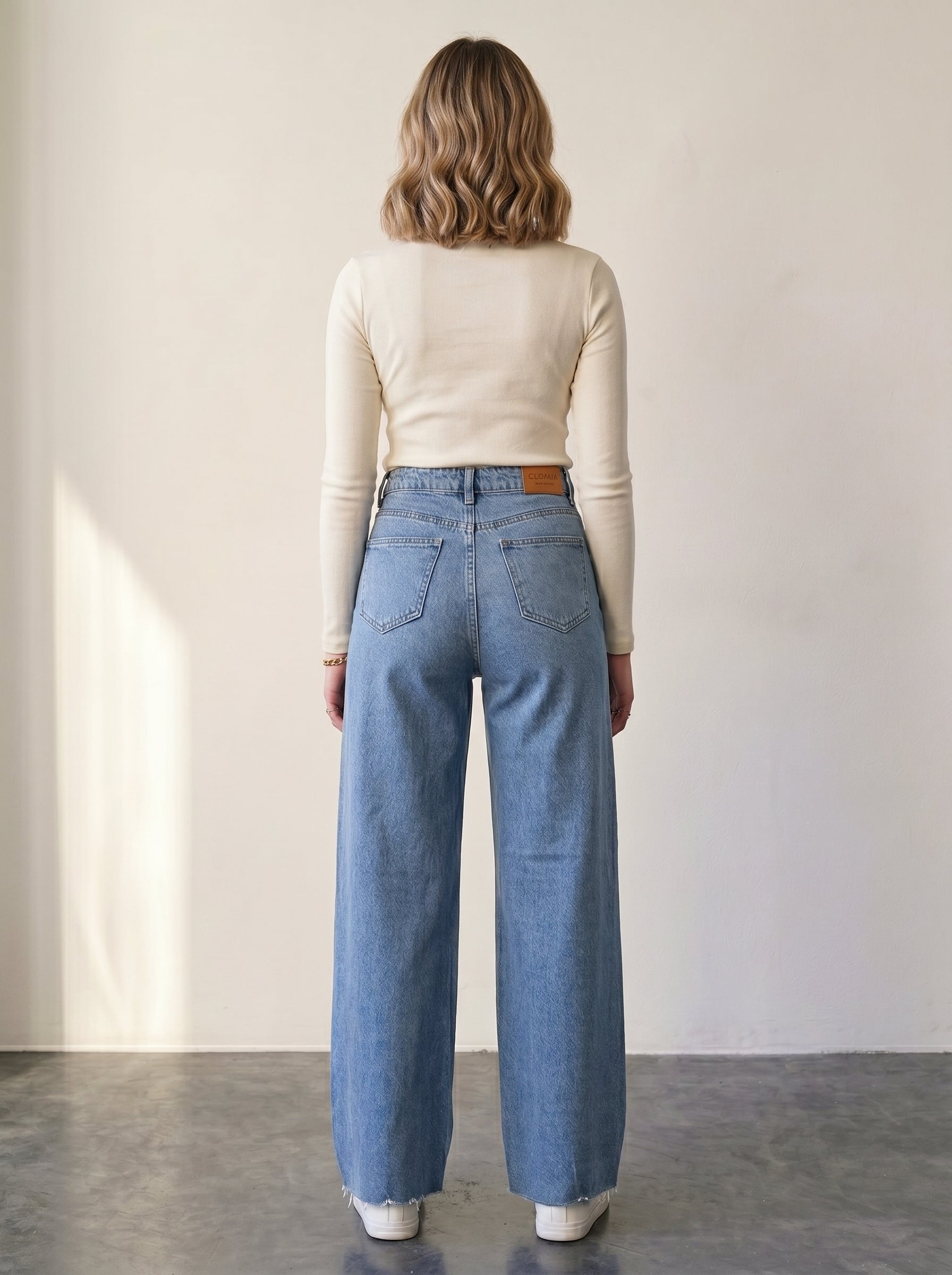 High-waisted, wide-leg jeans with raw hems