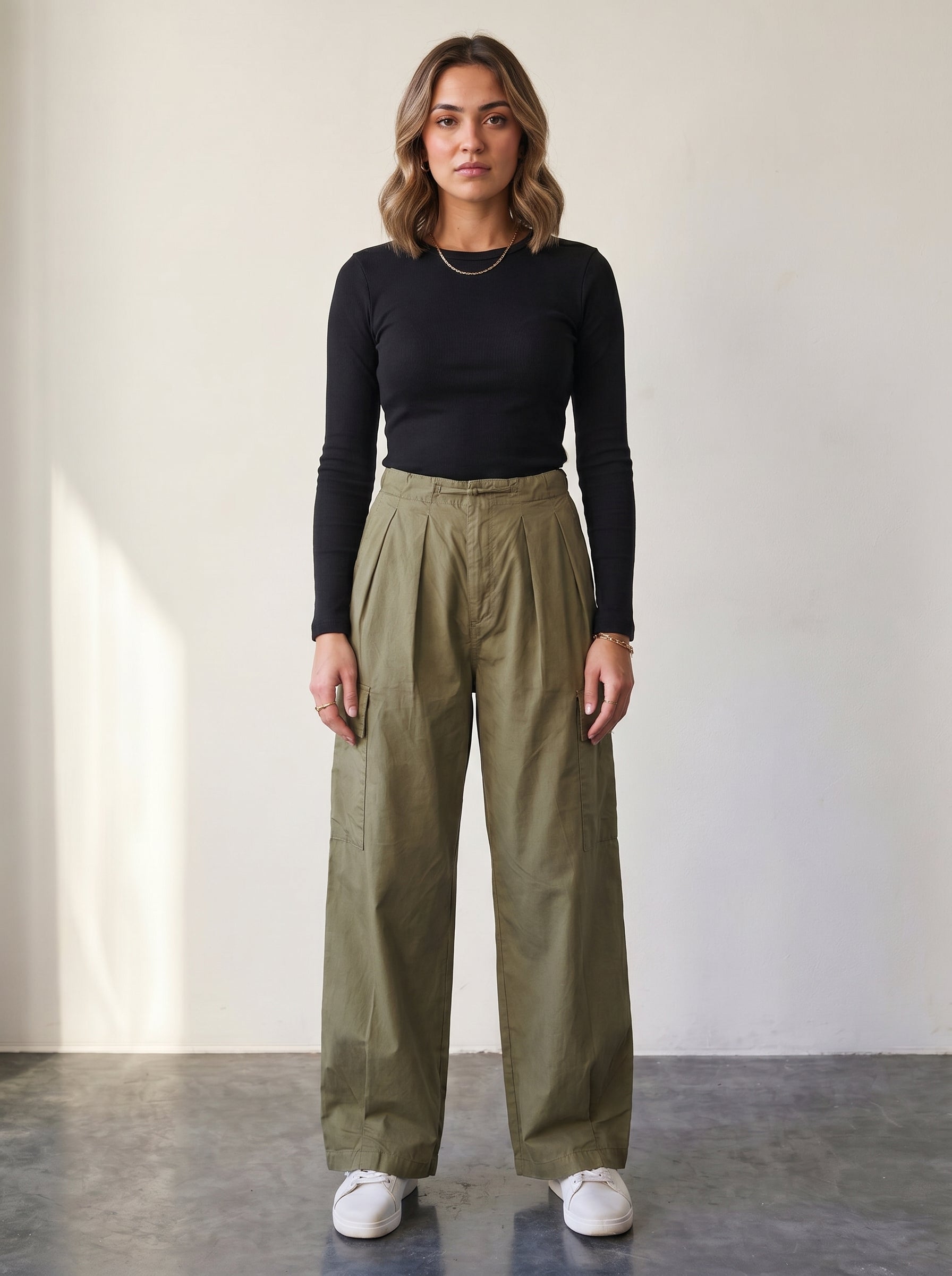Olive high-waisted cargo pants with drawstring.