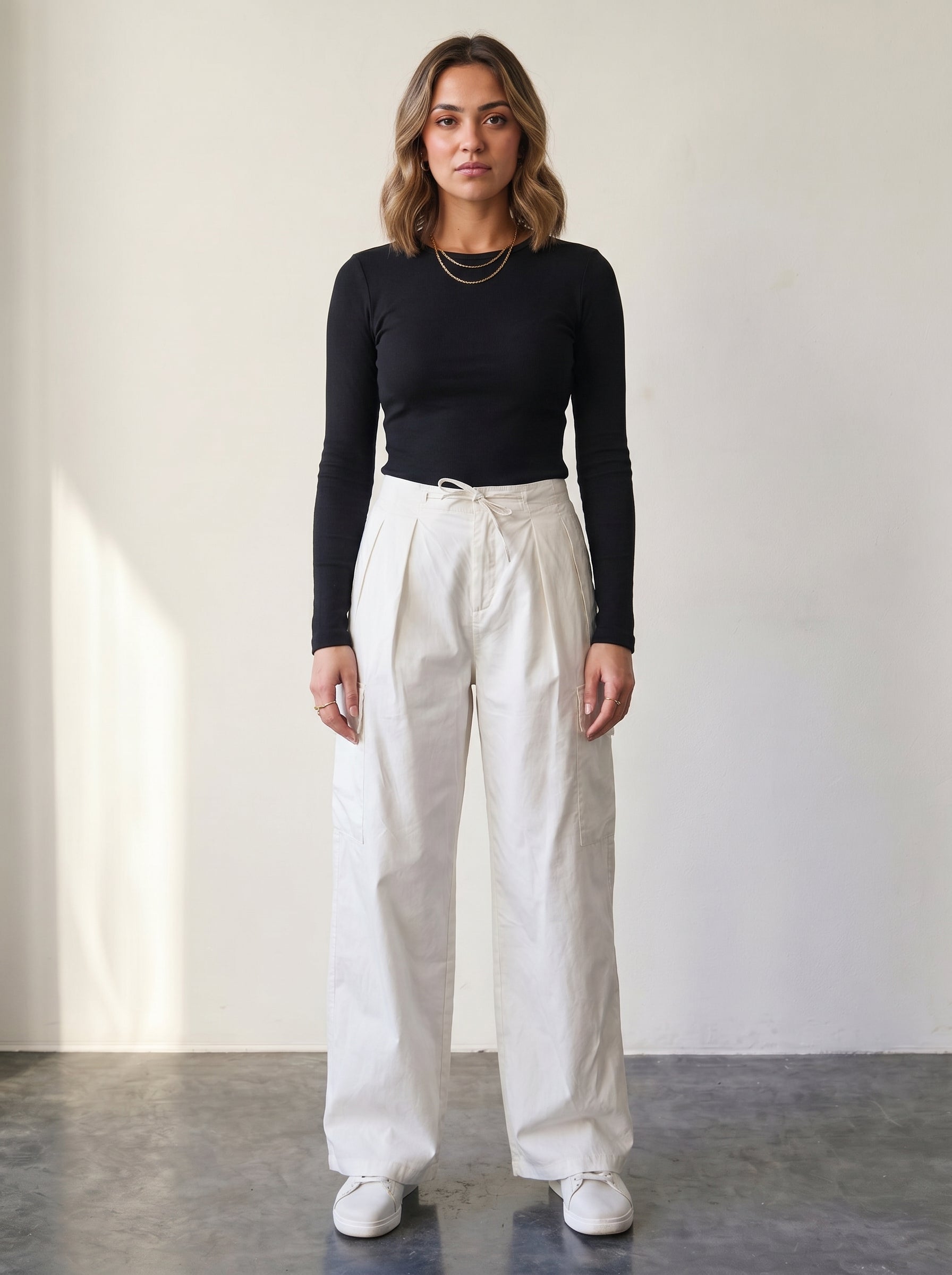 Light beige high-waisted cargo pants with a drawstring.