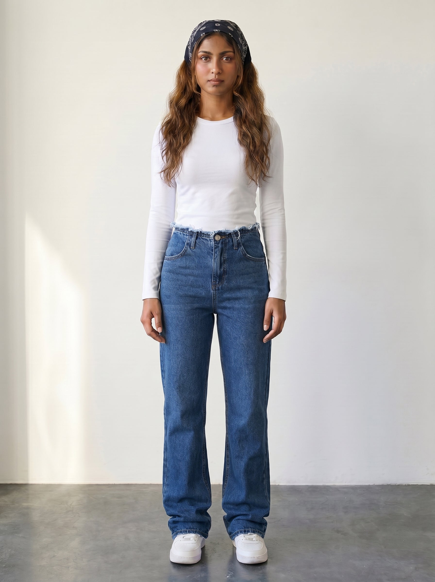 High-waisted straight-leg jeans with raw-edge waist detail