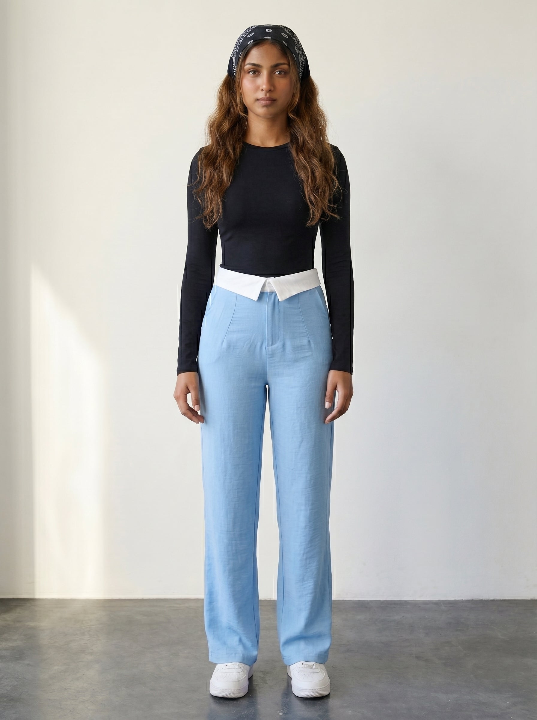 Light blue wide-leg woven trousers with a foldover collar waistband detail and a high rise