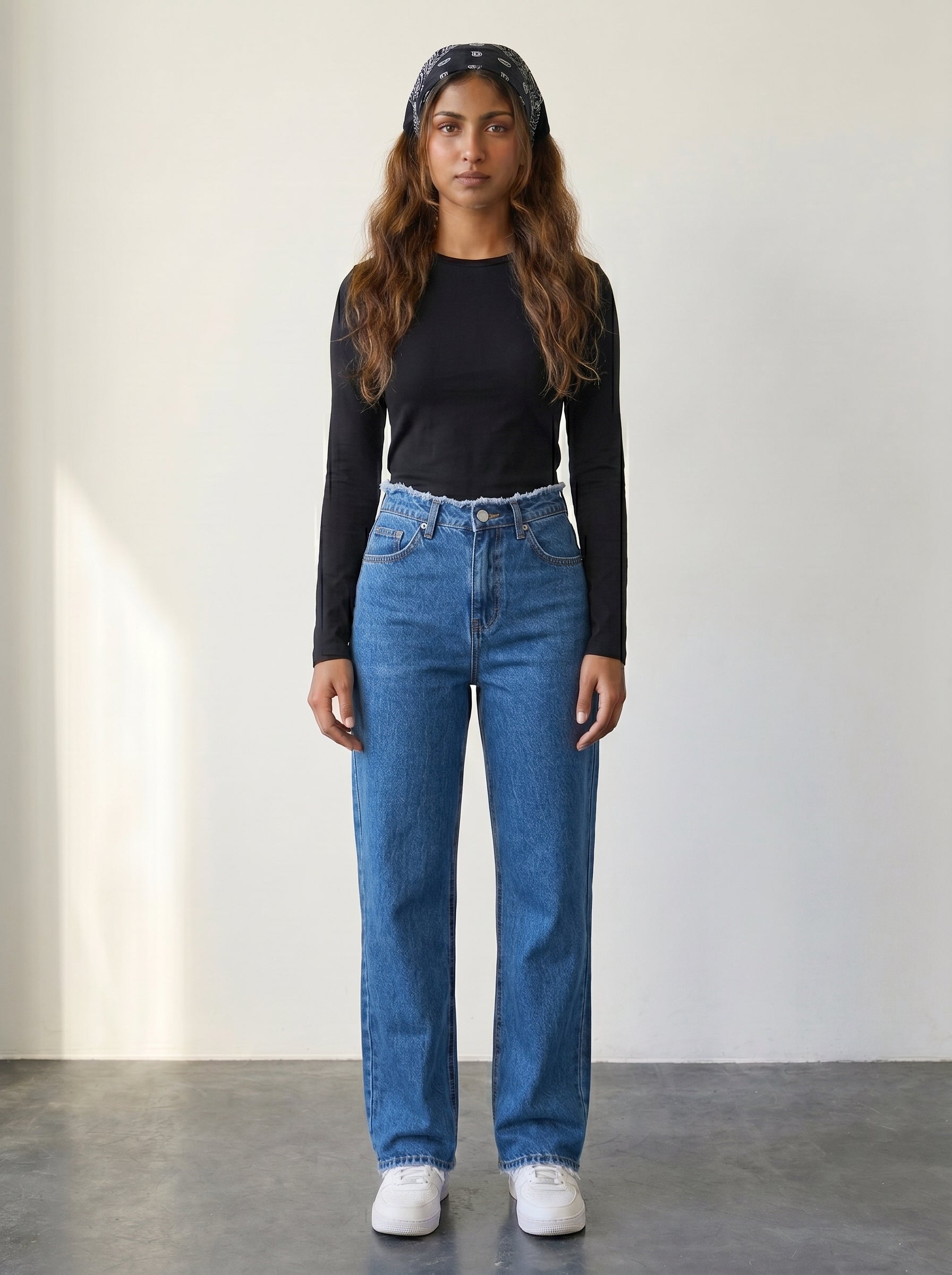 Straight-leg jeans with raw-edge waist detail and a high waist