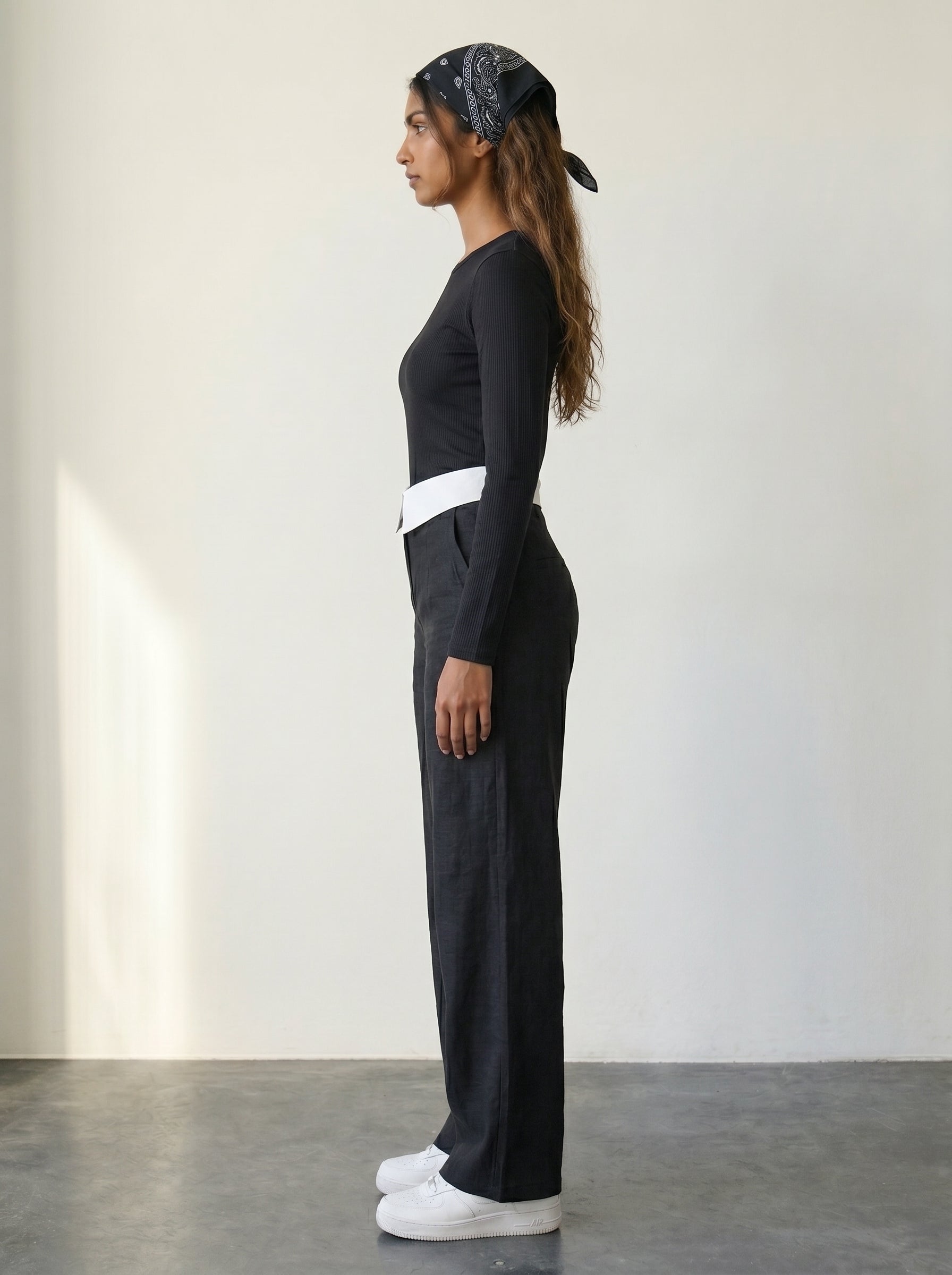 Black wide-leg woven trousers with a folded collar waist detail and a high waist