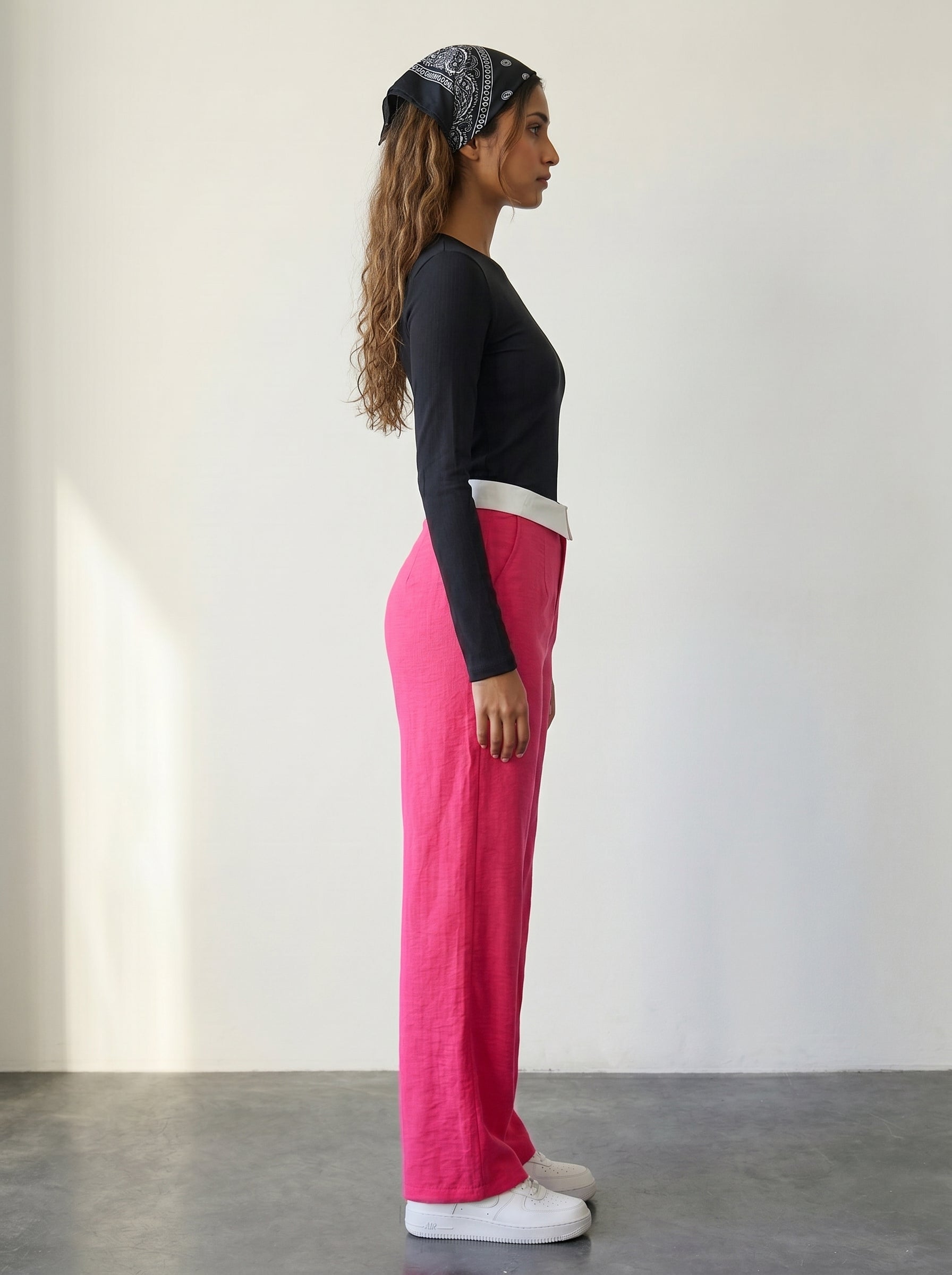 Pink knitted wide-leg pants with a fold-over waist detail and high waist