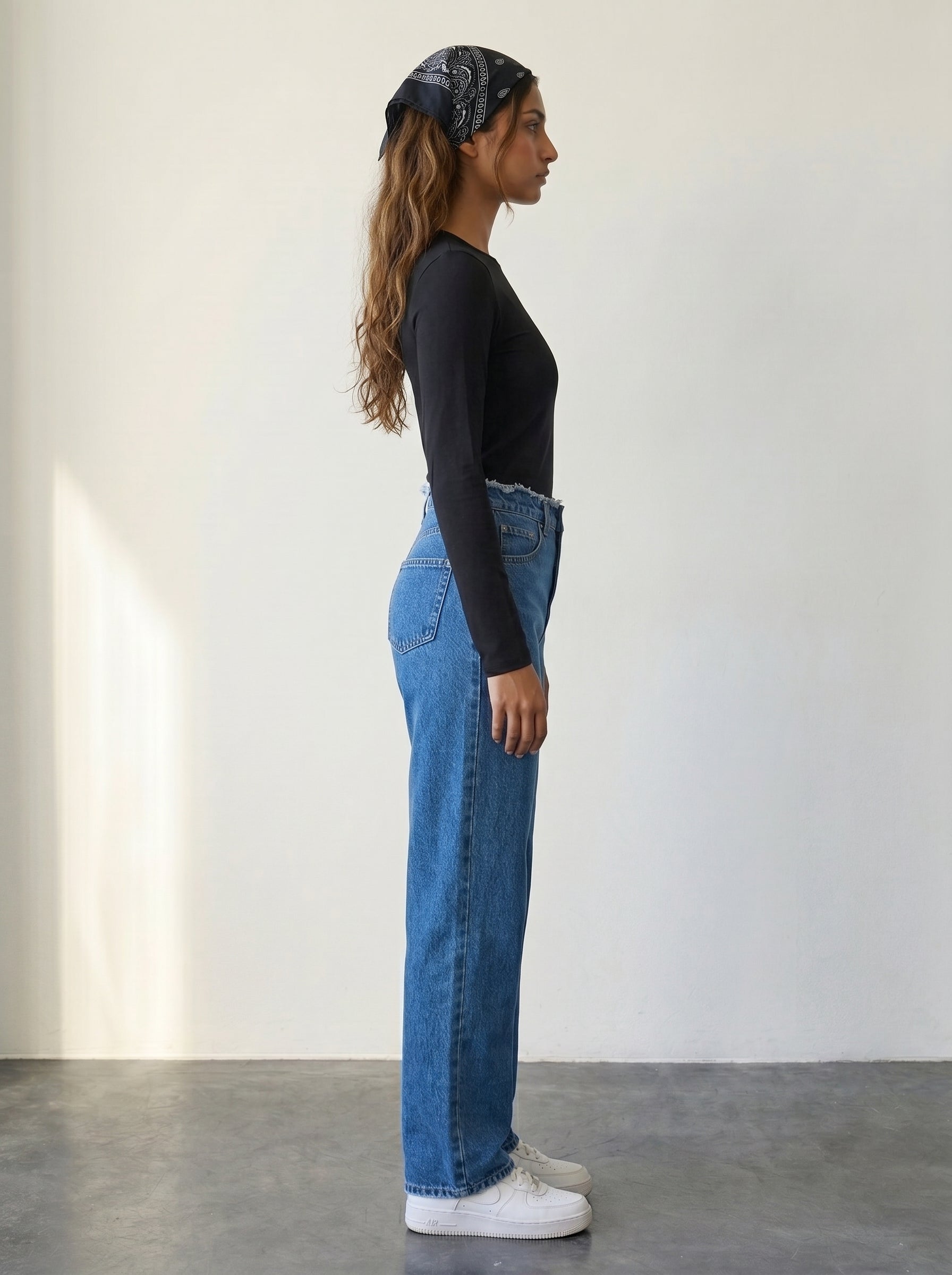 Straight-leg jeans with raw-edge waist detail and a high waist